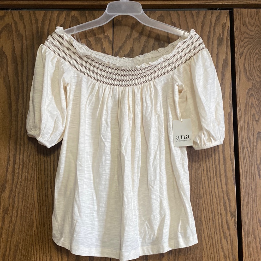 cream colored off the shoulder top